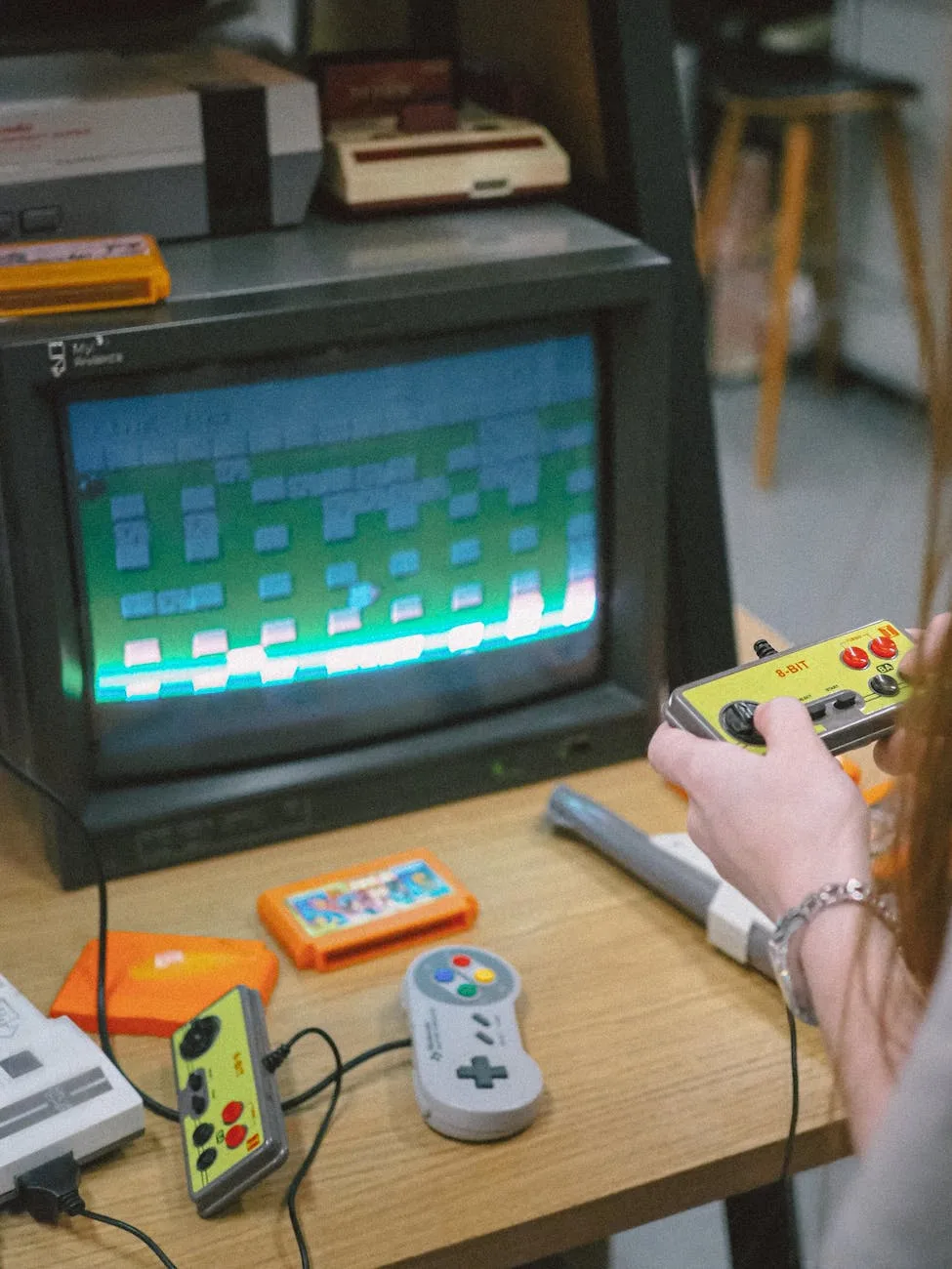 person playing vintage nintendo playstation