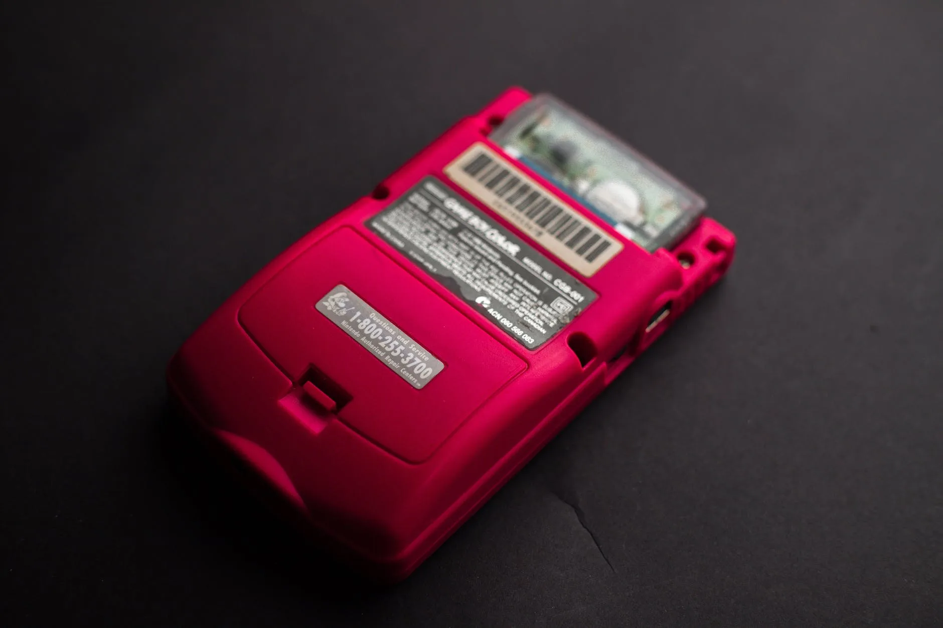 back view close up photo of red game boy console