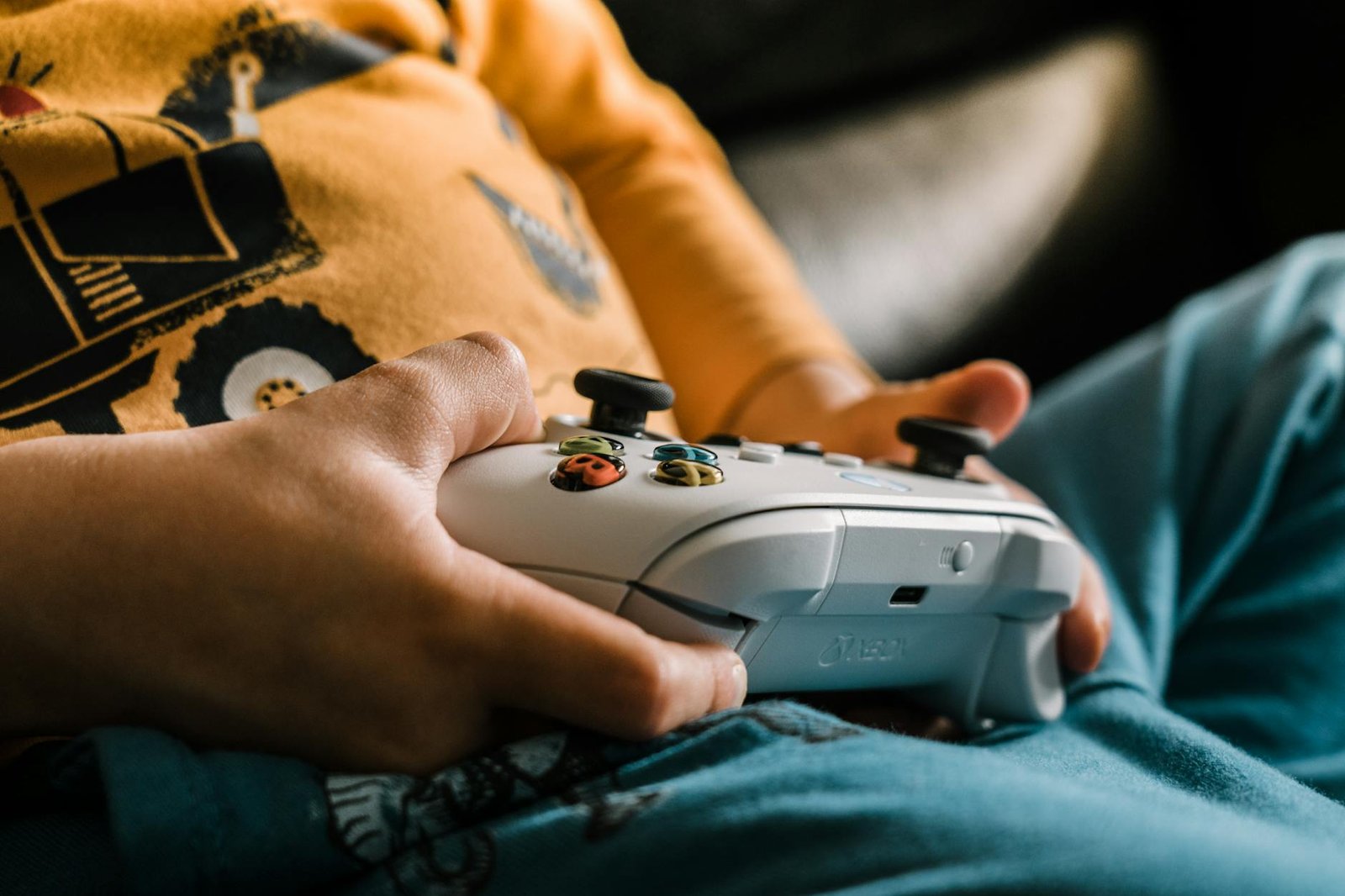close up of holding xbox controller, maybe online gaming