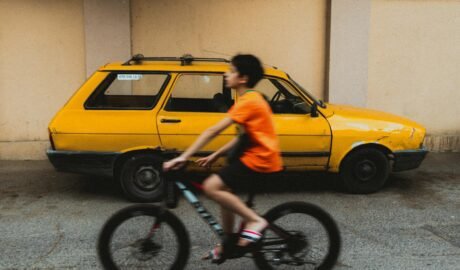 boy cycling on a street