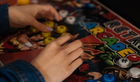 person playing an arcade game