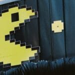 pac man themed sign with bird in almaty