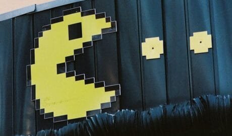 pac man themed sign with bird in almaty