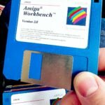man finger holding vintage disk